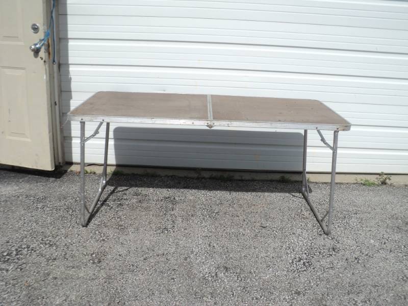 lot 9214 image: Folding table, 62 x 30 x 30, metal legs, used- great table for a garage sale