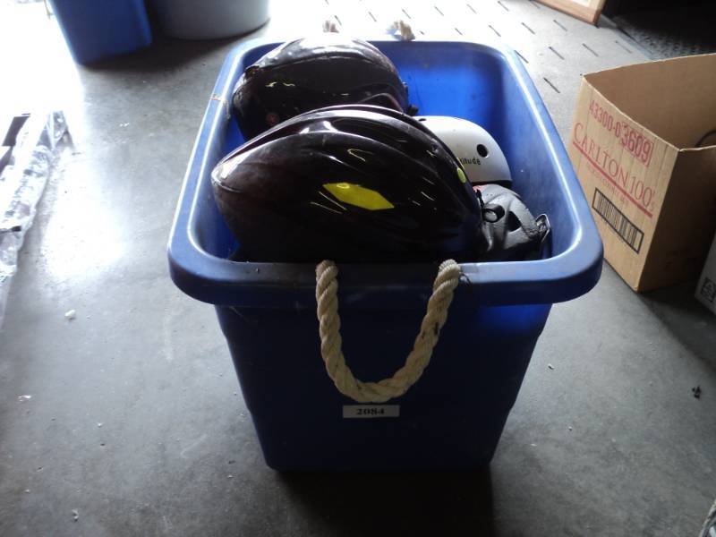 lot 9236 image: Muck Bucket with Bicycle helmets, used, assortment of sizes styles