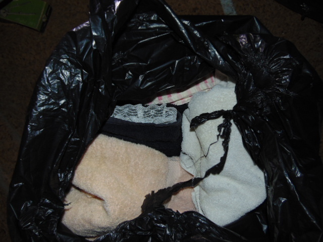 lot 18849 image: trash bag of folded towels and blankets