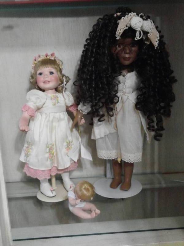 lot 7806 image: Porcelain Dolls with Stands and One Baby Doll