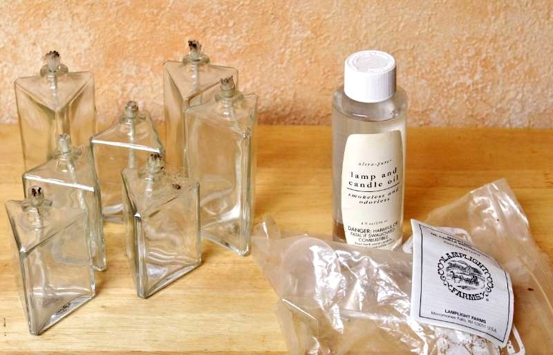 lot 1475 image: 7 Glass Oil Candles with wicksoil