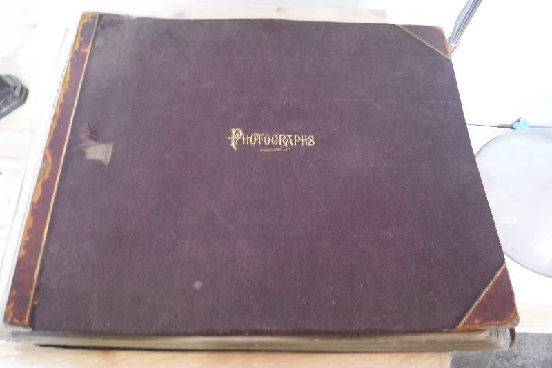 lot 3154 image: Vintage photo book with religious photos in it