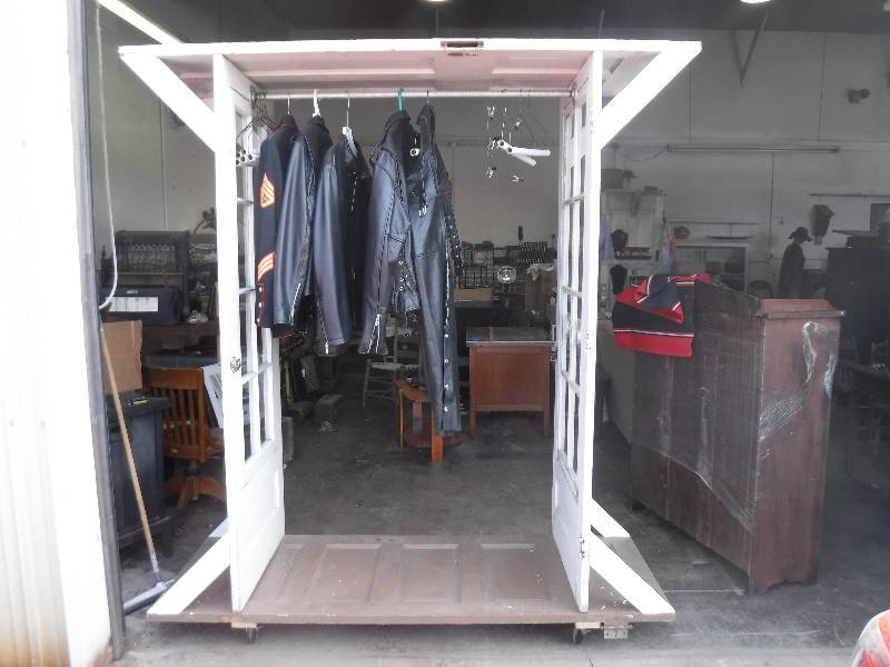 lot 2197 image: Rolling clothes display rack made of vintage doors Totally cool and unique display