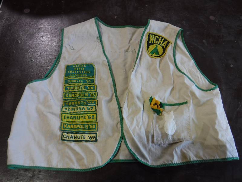 lot 2169 image: Open front Vintage Kansas Jayhawkers Campers vest with Kansas state convention campers patches from the 60s