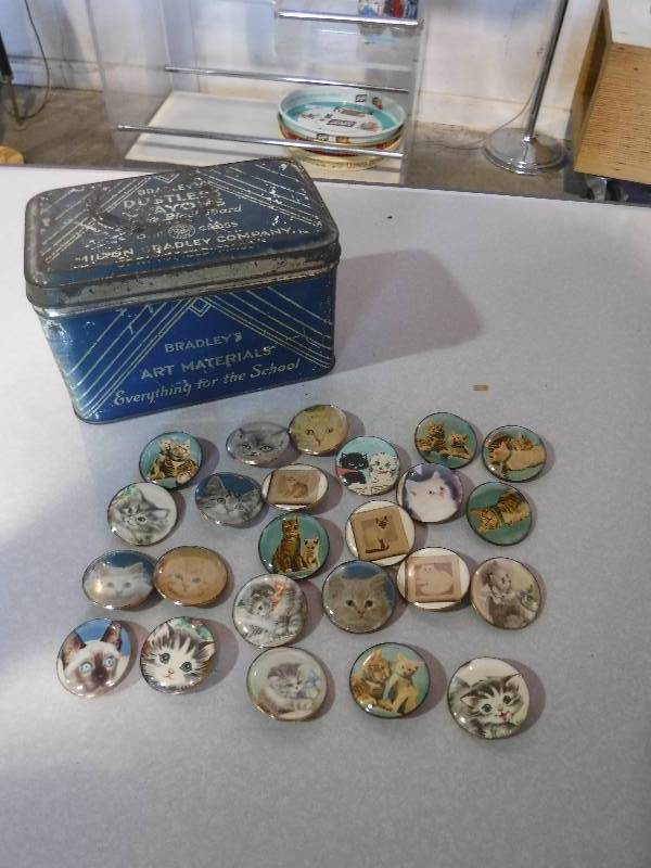 lot 3180 image: Milton Bradley tin with cat buttons