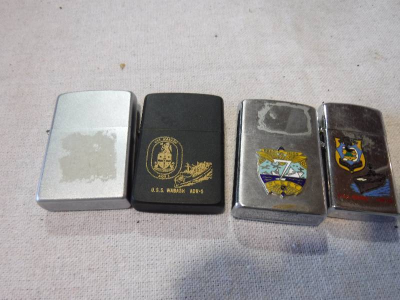 lot 3181 image: 4 windproof zippo and zippo style lighters with Navy themes on them