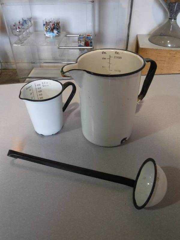lot 3217 image: Enamel pitchers with measurement markings and a ladle
