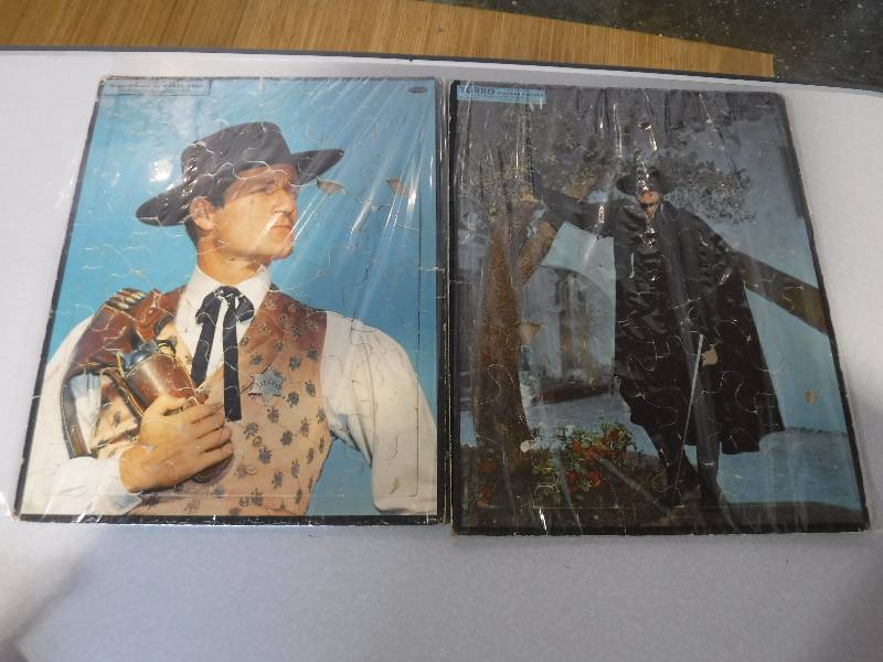 lot 3198 image: Hugh O Brian as Wyatt Earp and Zorro framed puzzles