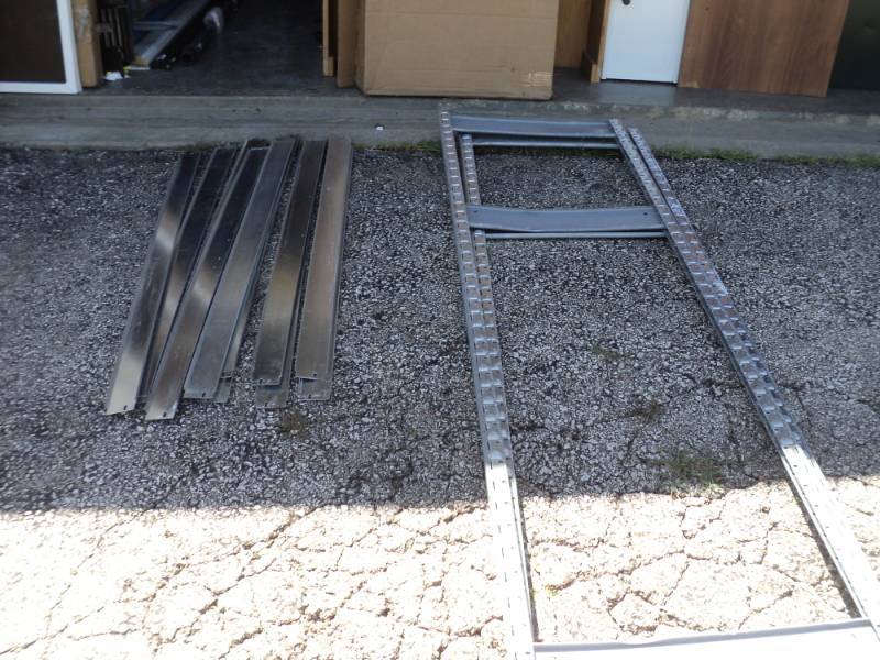 lot 9394 image: Mixed lot shelf parts, end brackets, shelf braces-- pieces only, this does not make a completed shelf