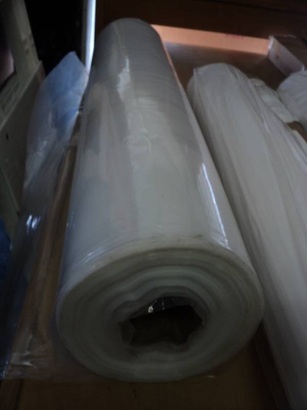 lot 9402 image: (1) roll clear plastic 36 x approx 500, box knife damage