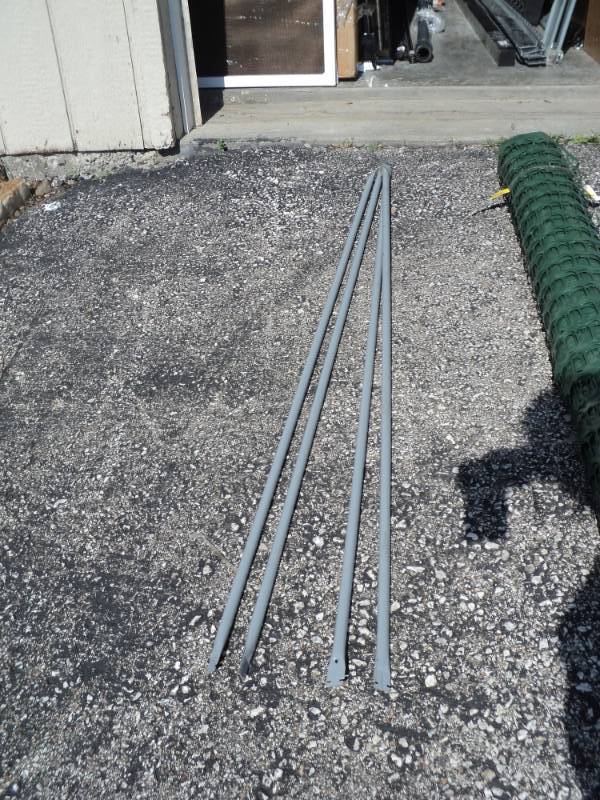 lot 9411 image: (4) metal pipe, 55 long, tapered ends