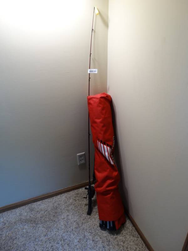 lot 437 image: Fishing pole and fold up chair in carry bag.