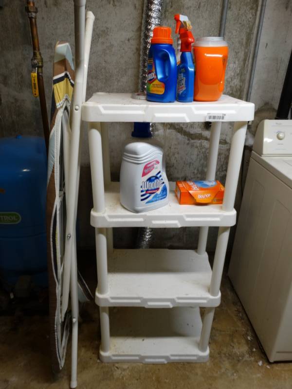 lot 739 image: Plastic shelf w laundry soap & ironing board