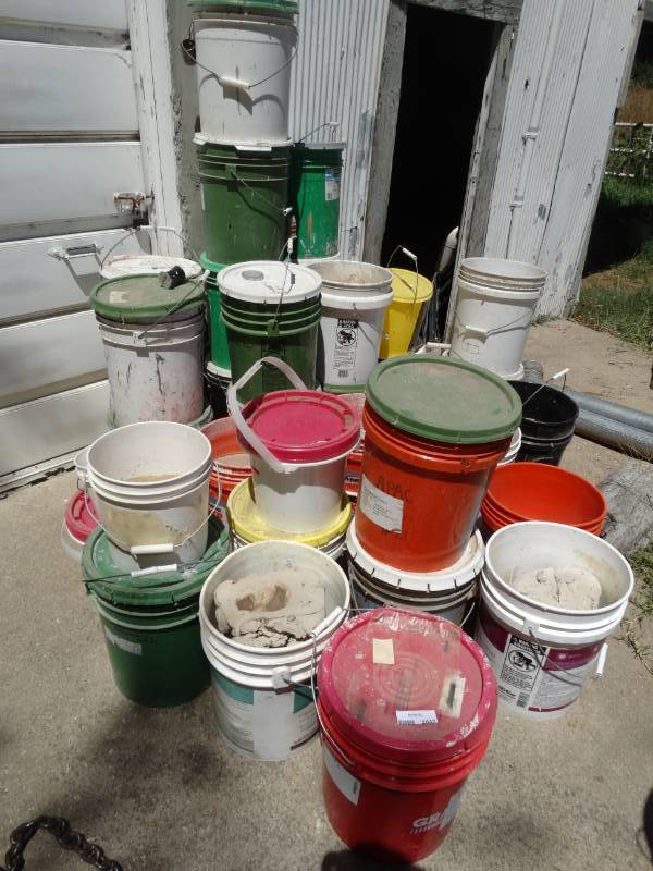 lot 2042 image: Large lot of various sized buckets w ceramic making supplies