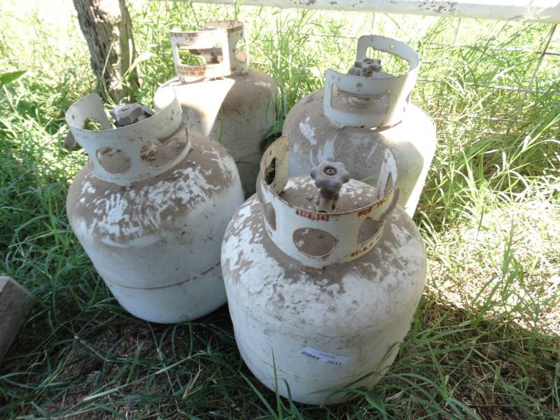 lot 2053 image: 4 propane tanks- 2 appear to be full