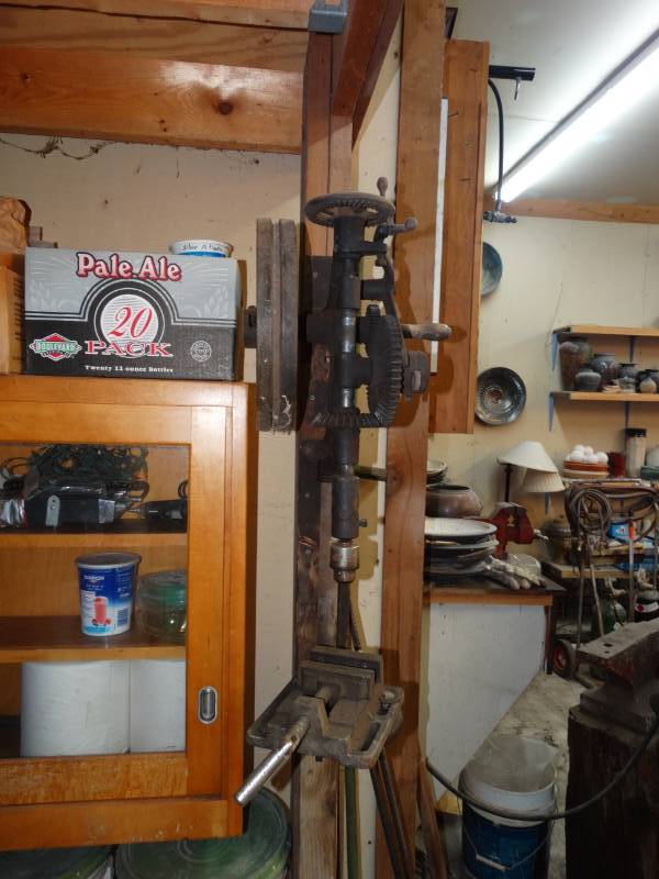 lot 2674 image: Antique wall mount hand crank drill press w drill bits