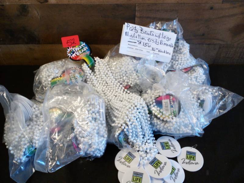 lot 52 image: Party Beads with Logo Medallion Easily Removable