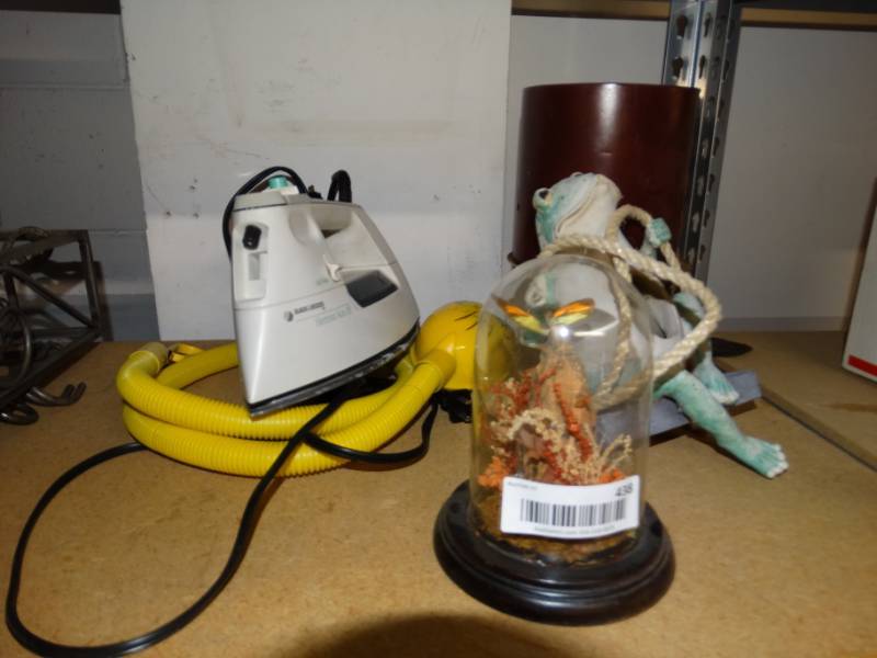 lot 438 image: Lot with iron, hanging outdoor decor, tweety bird light, large candle.