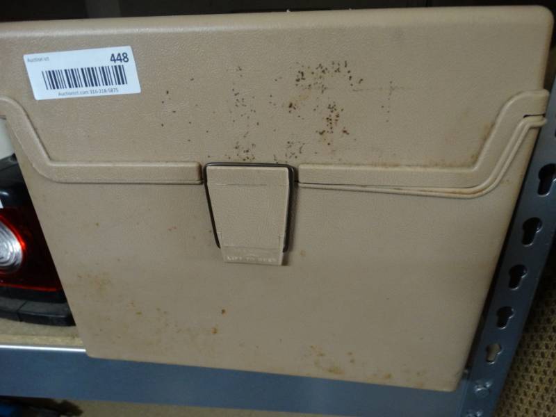 lot 448 image: Small plastic comtaoiner with books.