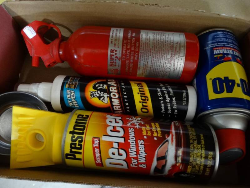 lot 456 image: Glade plug in, WD-40, dry chemical fire extinguisher, armor all protectant and de icer.