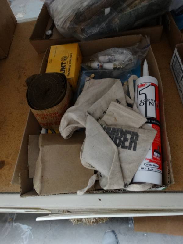 lot 496 image: Cabinet handles, Gold video cable, adhesive sealant, rubber bands and more.