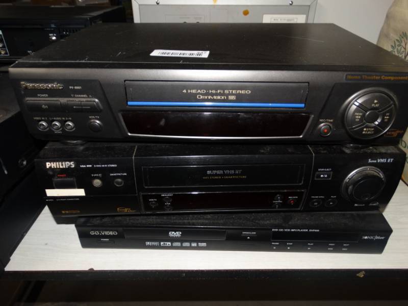 lot 547 image: Panasonic VHS player, Phillips VHS player and a Go video DVD player.