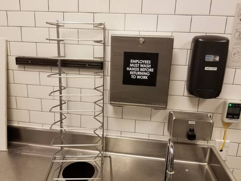 lot 2547 image: Metal Rack, Paper Towel Holder, Soap Dispenser and Sanitizer Dispenser