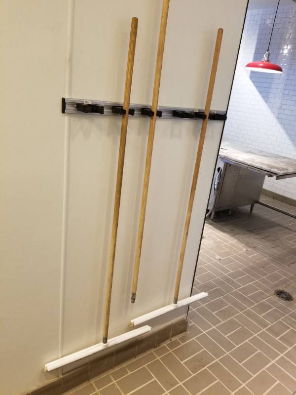 lot 2548 image: Wall Mounted Broom Holder