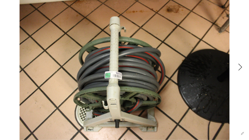 lot 1815 image: Garden Hose on Hose Reel Holder