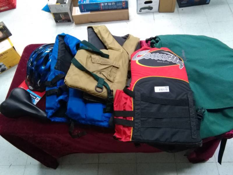 lot 5476 image: Lot of 3 Life Jackets, Northern Boundary Outfitters Backpack Bag and Bicycle Seat and Helmet