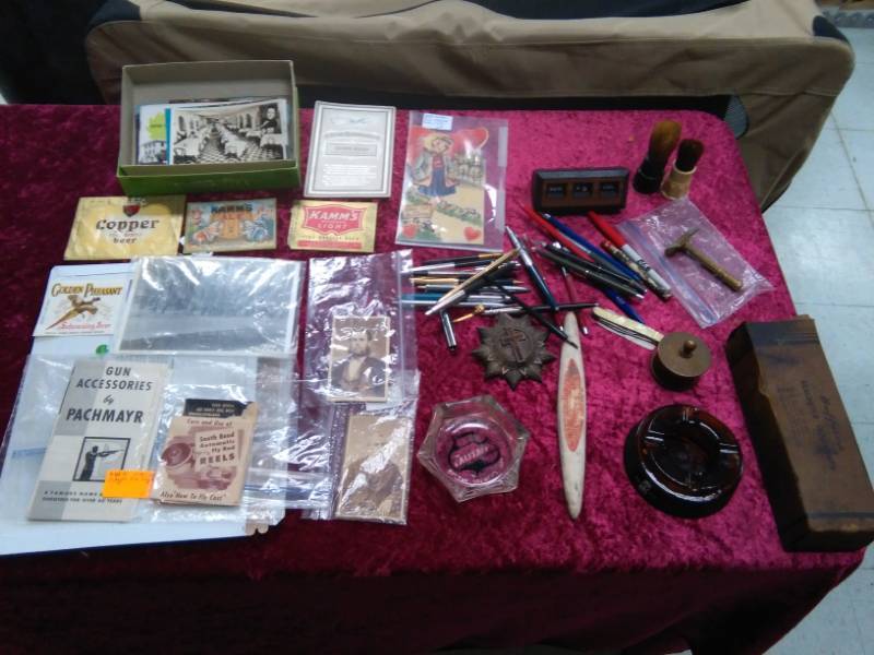 lot 5550 image: Ephemera and Vintage Collectibles - Metal Oil Spout, Glass Advertising Ashtrays, Ink Pens Lot, Sharpening Stone, Pictures�.