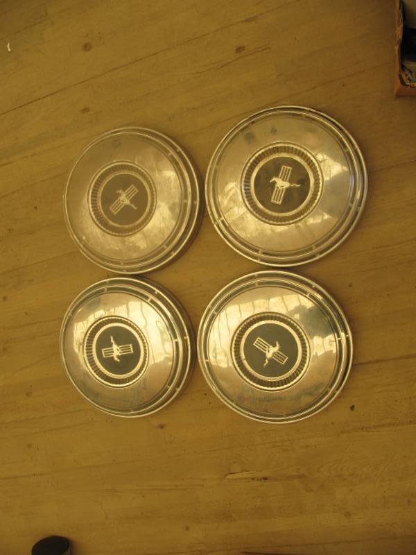 lot 2236 image: 4 vintage 1968-69 Ford Mustang metal hub caps