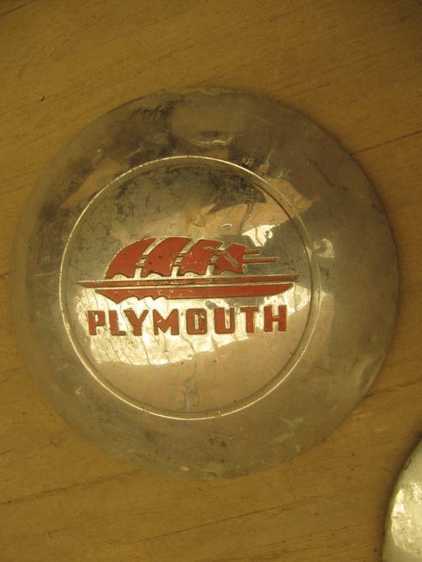 lot 2237 image: 4 Vintage 1940s Plymouth 10 Clipper Sail Ship metal hub caps
