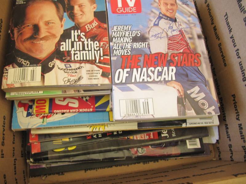 lot 2280 image: 2 boxes of collectible Nascar cards, books placemats and misc