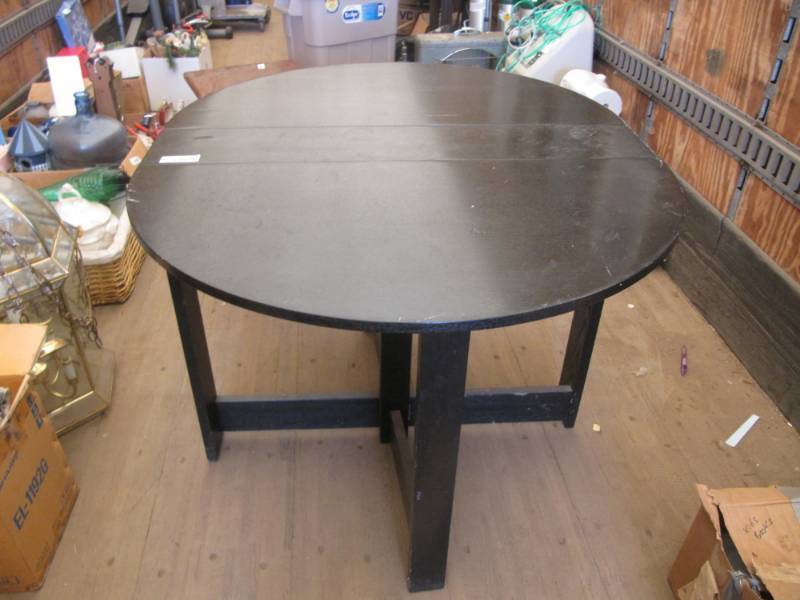 lot 2288 image: Black wood table with folding legs and drop down top