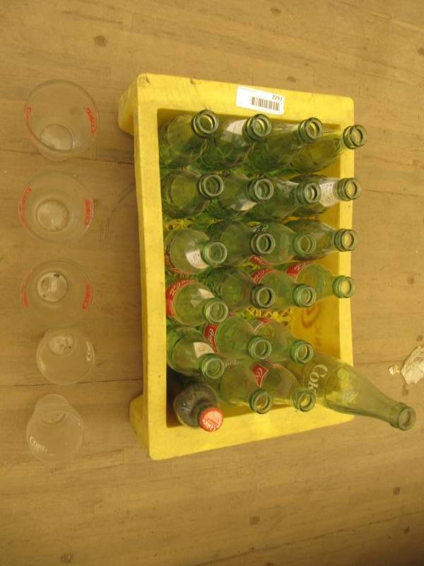 lot 2293 image: yellow plastic coke case with coke bottles and coke glasses