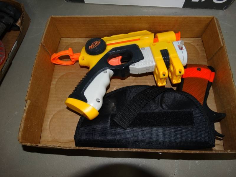 lot 72 image: Nerf gun and airsoft pistol in holster.