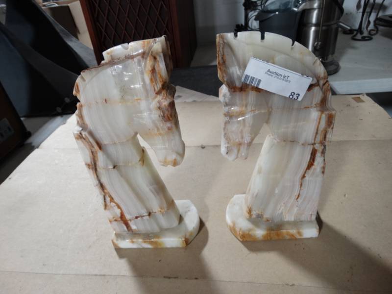 lot 83 image: Pair of horse head book ends.