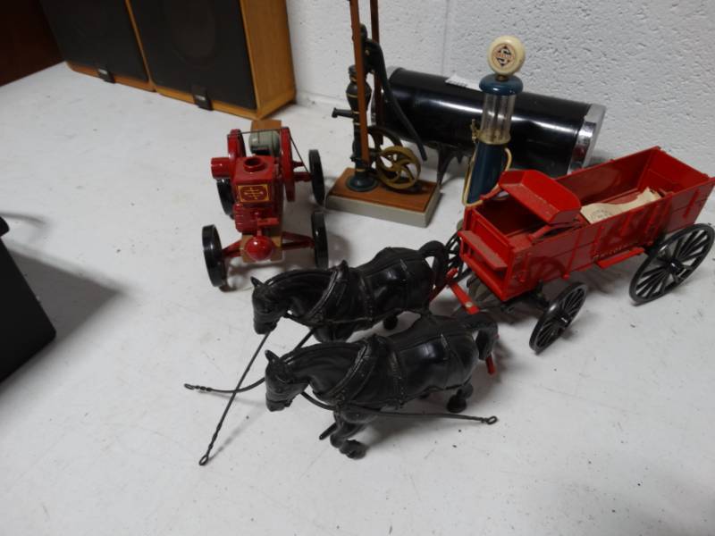 lot 100 image: McCormick die-cast wagon, Waterloo boy die-cast tractor and skelly die-cast gas pump.
