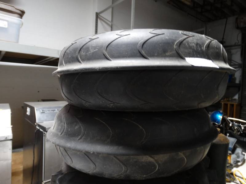 lot 142 image: 2 diamond track wheels.