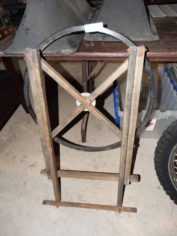 lot 155 image: Metal wheel on stand.