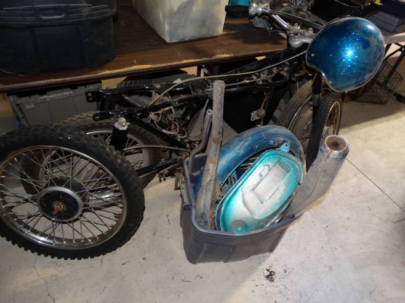 lot 156 image: Motor bike with helmet, partsattachments and 2 spare wheels.