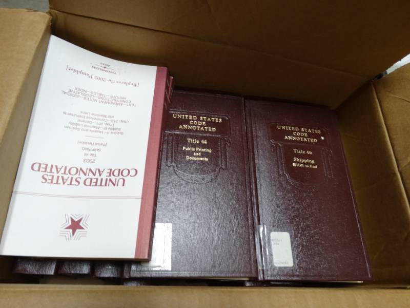 lot 165 image: Lot of code enforcement books.