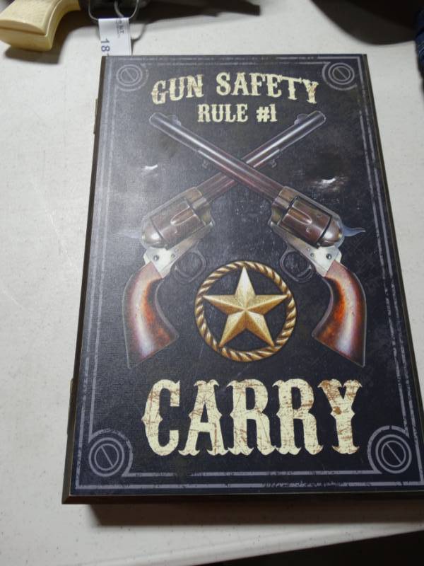 lot 180 image: Gun safety rule #1, carry key box.