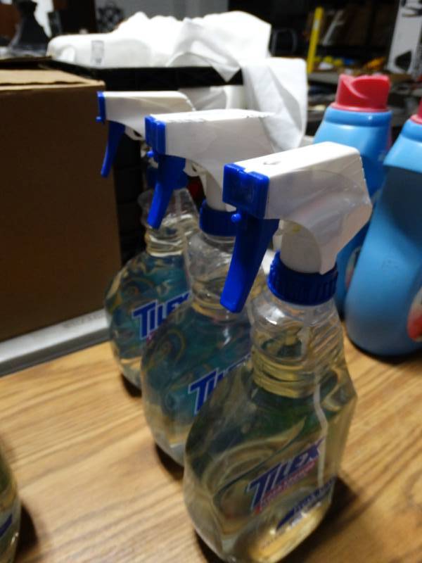 lot 203 image: Three bottles of tilex cleaner.
