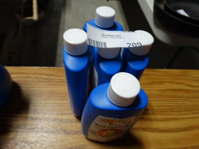lot 209 image: Four bottles of mrs. Stewart concentrated liquid bluing.