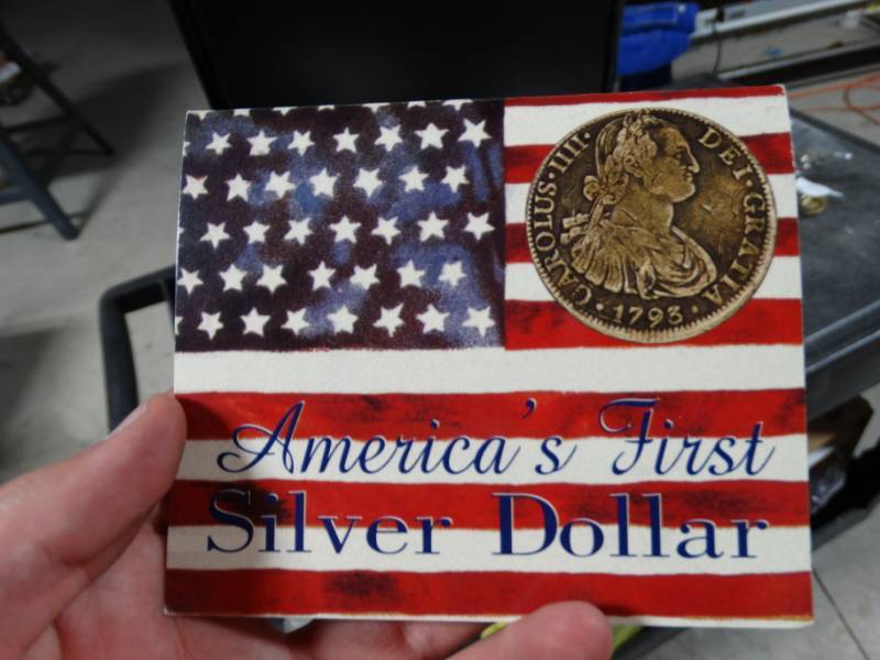lot 215 image: Americas first silver dollar 1772-1821 replica coin.