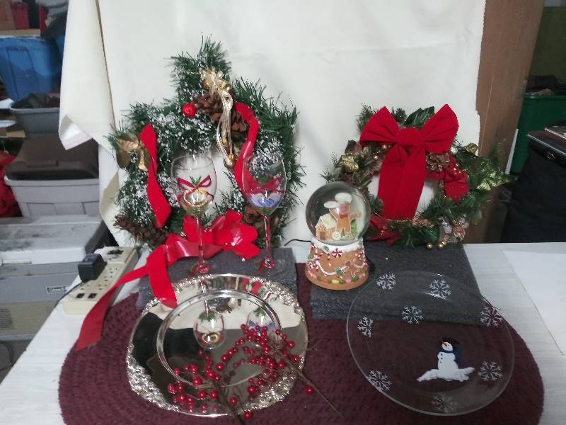 lot 2082 image: Gingerbread Snow globe, two Christmas wreaths,  Cookie plate, Christmas wine glasses, Silver Serving platter