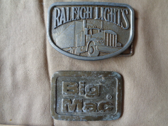 lot 7729 image: Big Mac and Raleigh Lights Belt Buckles