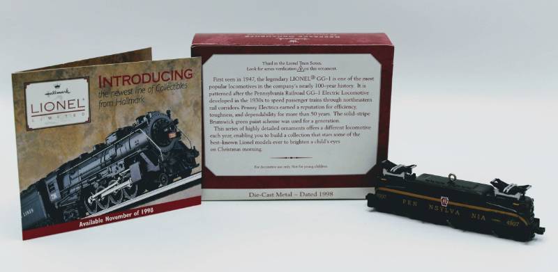 lot 1783 image: (4) Hallmark ornaments Keepsake and Collectors Series - Including Lionel Trains